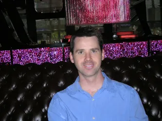 Dr. Furlich seated in a lounge